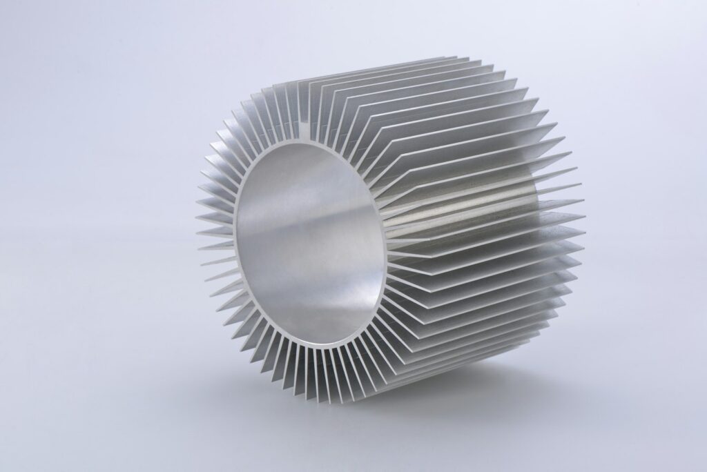 Silver aluminium extrusion on a white surface, an example of a component suited to anodising